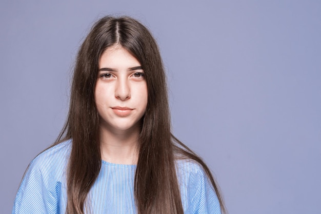 Girl with thick eyebrows posing in the studio