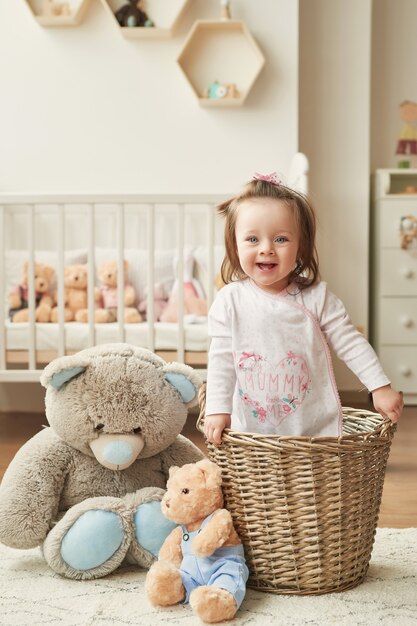 girl with toys in the children's room