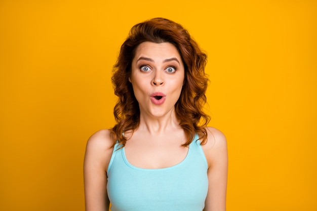 girl with trendy hairstyle isolated on orange