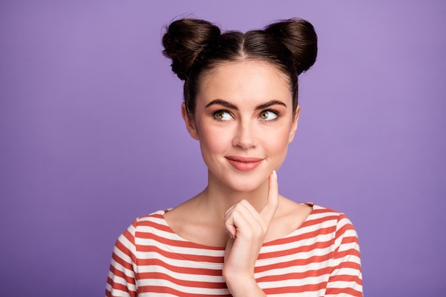 Girl with trendy hairstyle isolated on purple