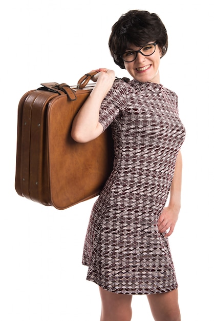 Girl with vintage look holding a suitcase