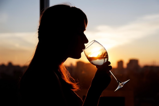 Girl with wine glass Black silhouette