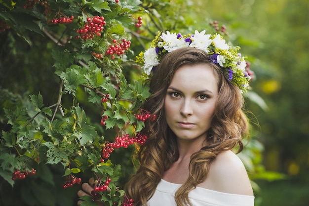 Girl with a wreath of flowers from a Bush of mountain ash 4790