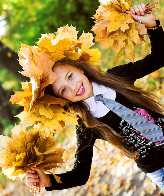 Girl with yellow leaves