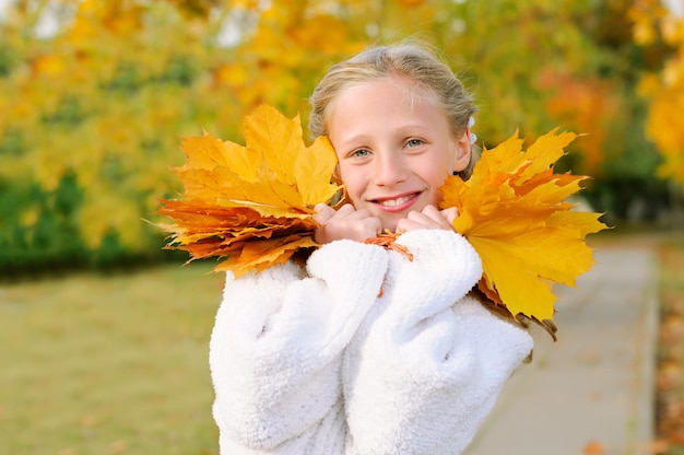 Girl with yellow leaves