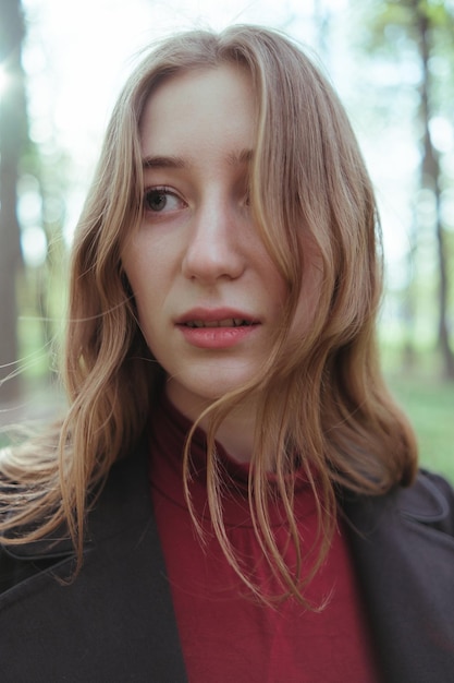 A girl in the woods looking for something closeup portrait