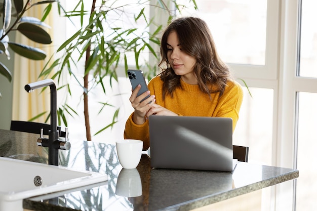 Girl working at home with a laptop during quarantine