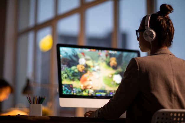 Girl working in the office at night