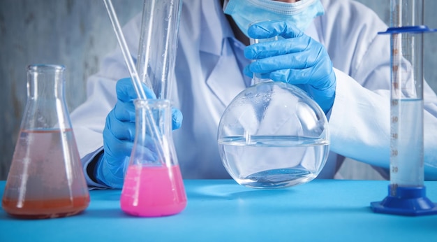 Girl working with flask in a laboratory