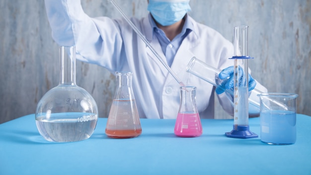 Girl working with flask in a laboratory