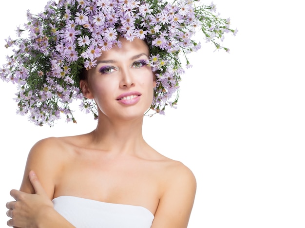 The girl in a wreath of purple daisies