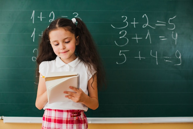 Girl writing in class