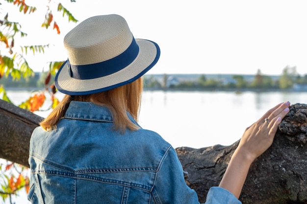 girl in yellow hat and with red hair