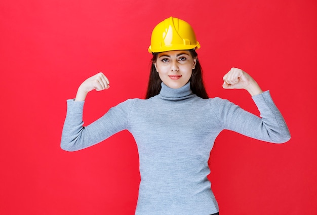 Girl in yellow helmet feeling positive.