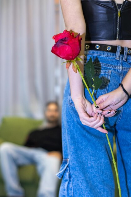 Girlfriend hiding a surprise rose for her boyfriend Girl hiding a rose for her boyfriend on valentine39s day