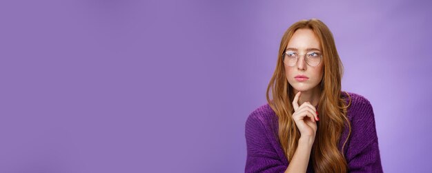 Girlfriend solving puzzle like detective making assumptions focusing on problem squinting looking                           person