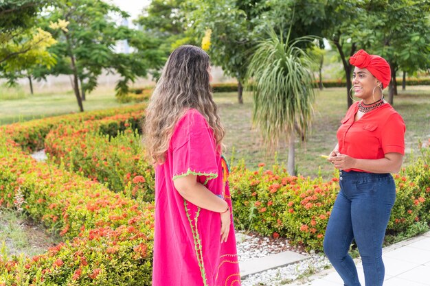 Girlfriends multiethnic meet in the city to take a walk and to talk