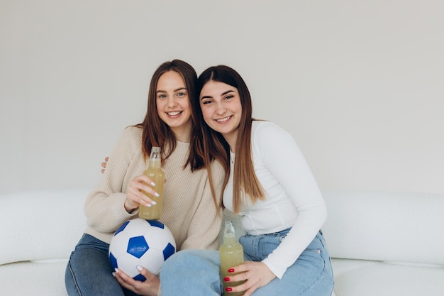 Girlfriends watching football at home