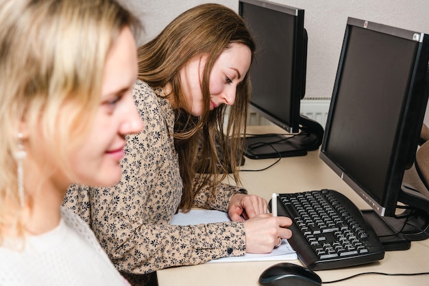 Girls are studying photoshop in a computer class