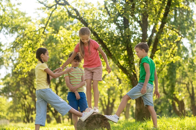 Girls and boys spending free time in park