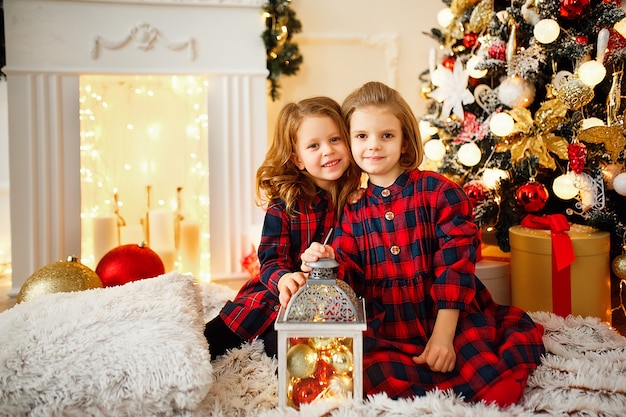 Girls under Christmas tree