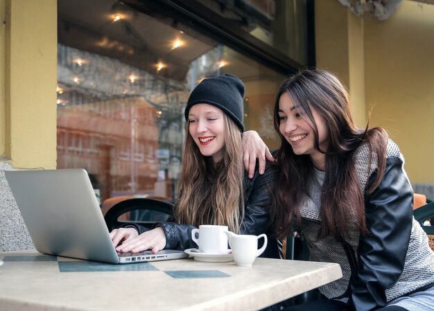 Girls having fun in a coffee shop