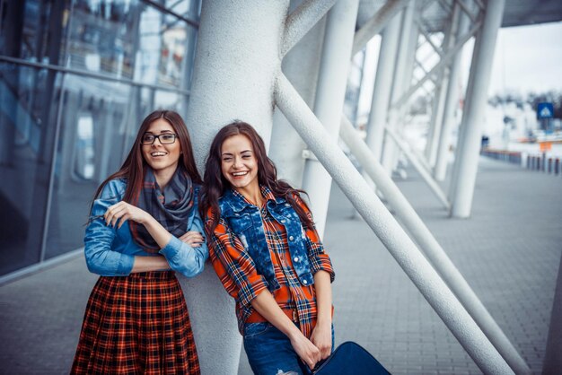 Girls having fun and happy when they met at the airportArt proc