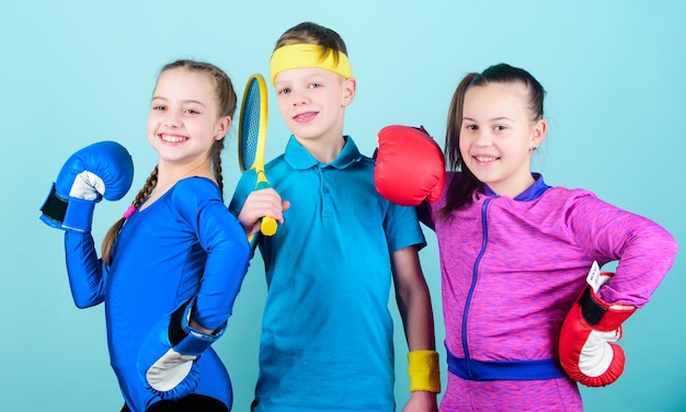 Photo girls kids with boxing sport equipment and boy tennis player ways to help kids find sport they enjoy sporty siblings friends ready for sport training child might excel completely different sport