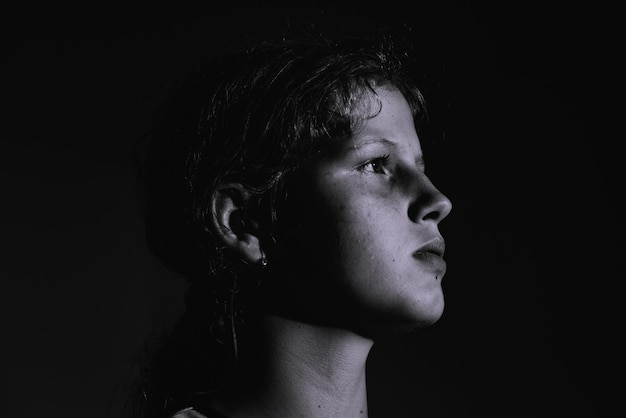 Photo girls looking away against black background