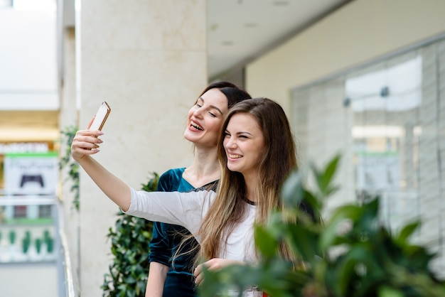 Girls make selfi at the Mall.