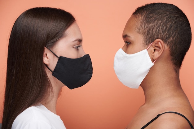 Girls in masks close to each other