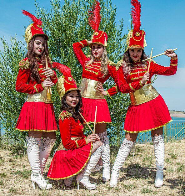 Girls in red hussar suits