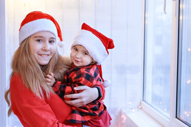 Girls in red Santa hats.