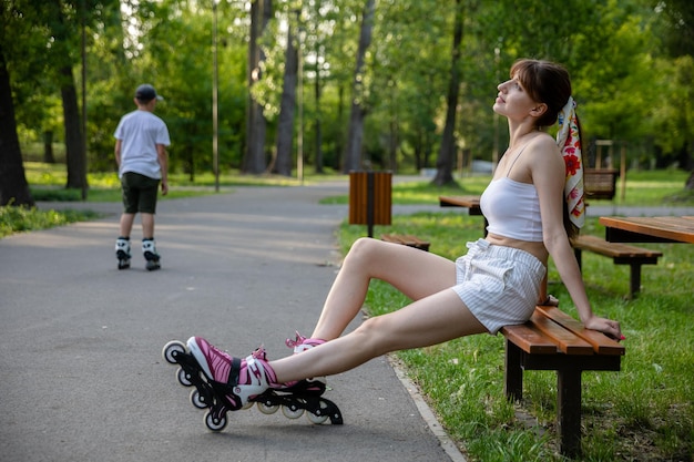 Girls and on roller skates relaxes after a practice