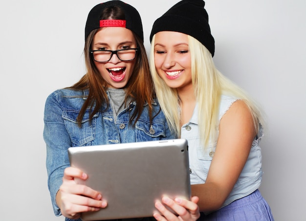 girls taking a self portrait with a tablet