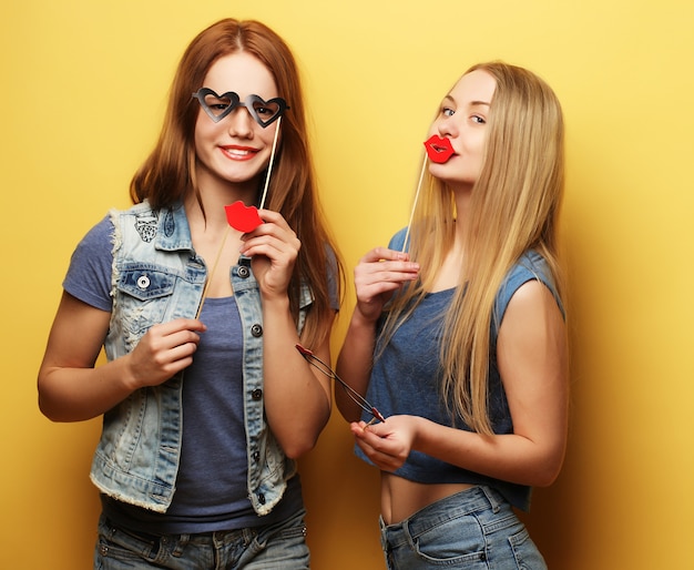 Girls with glasses and lips made from paper