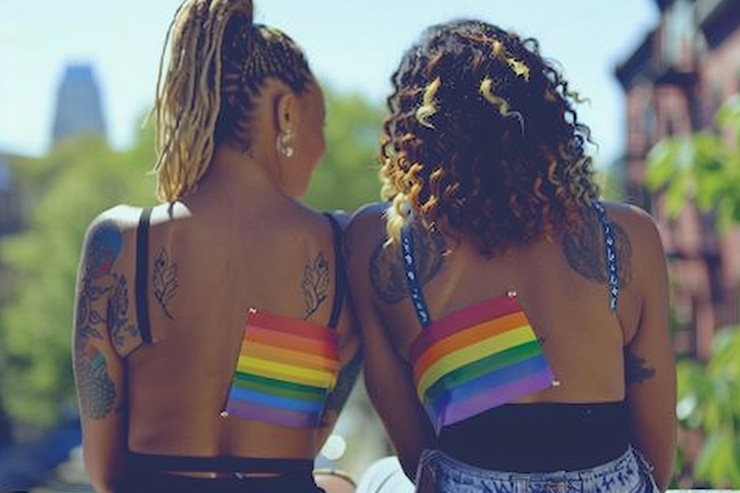 Photo girls with rainbow tattoos celebrating pride month