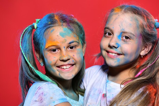 Girls with smiling face stand on red background close up