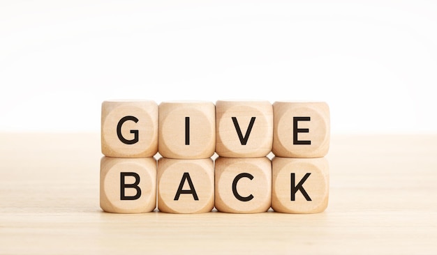 Give back message on wooden blocks Copy space