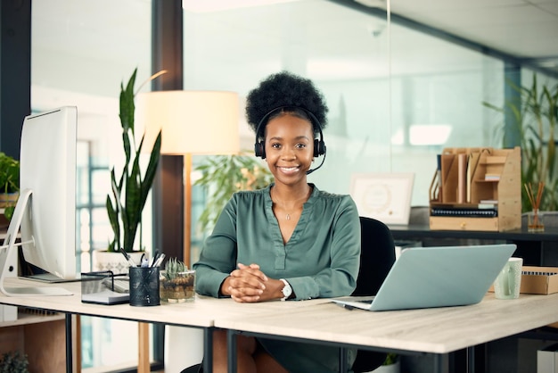 Give me a call and Ill help you out Portrait of a young businesswoman wearing a headset while working in an office