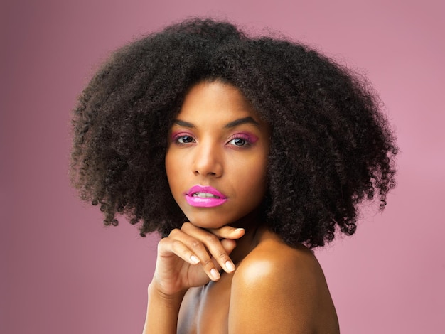 Give yourself the gift of confidence Studio shot of an attractive young woman posing against a pink background