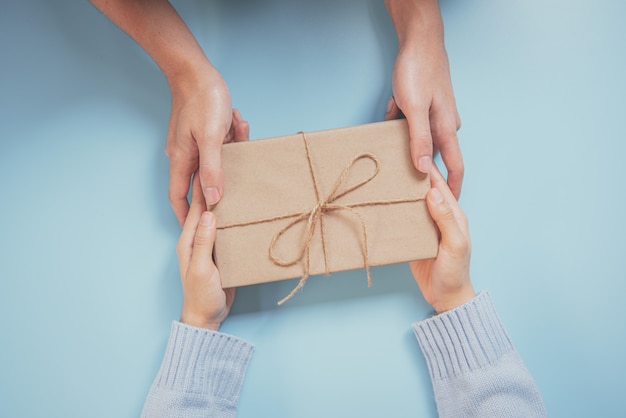 gives a gift christmas and new year presents laid on a blue background.