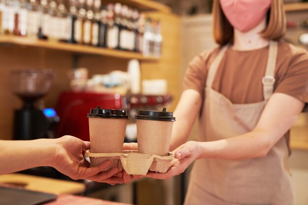 Giving Coffee Cups To Customer