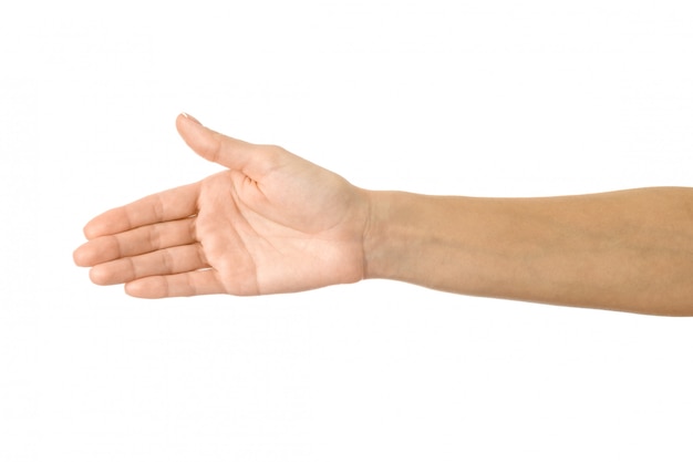 Giving hand for handshake. Woman hand gesturing isolated on white