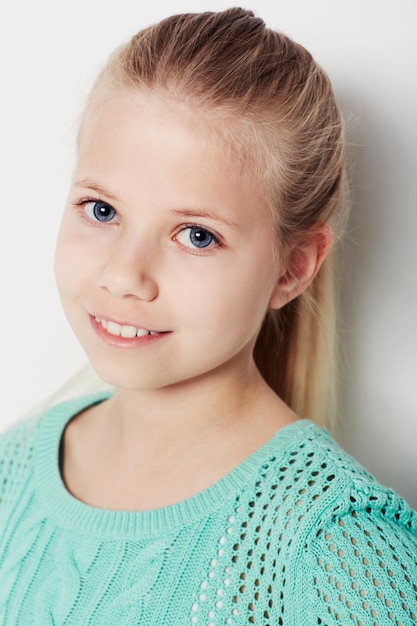 Giving you a smile Portrait of a confident young girl standing in the studio