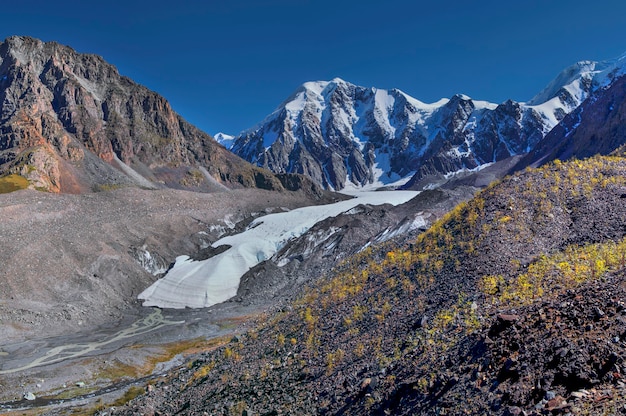 Glacier in a mountain valley sunny summer day