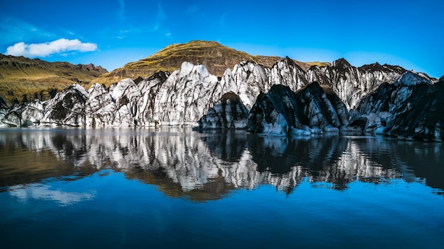 Glacier tongue end over the lake with reflection