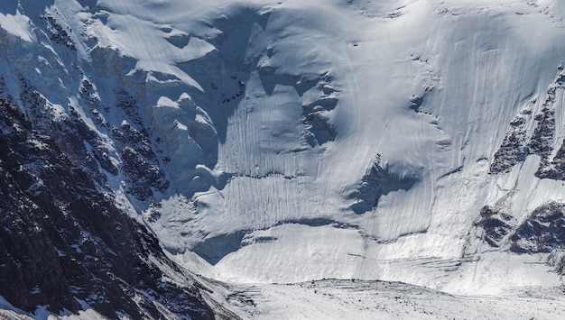 Glaciers and snow on a steep hillside, traveling in the mountains, climbing