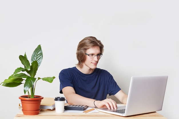 Glad male entrepreneur checks report online