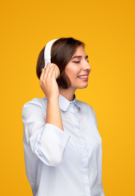 Glad woman listening to music